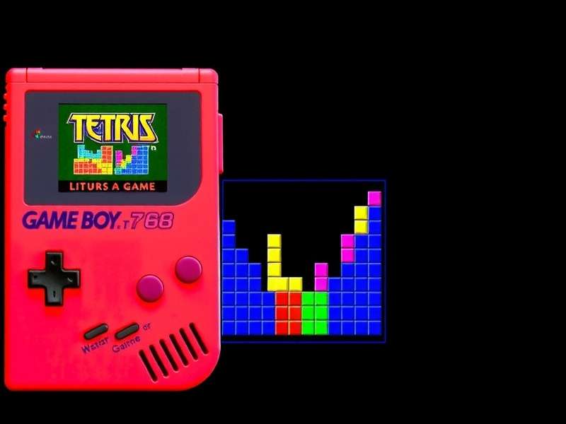 Original Nintendo Game Boy running Tetris video game with cartridge
