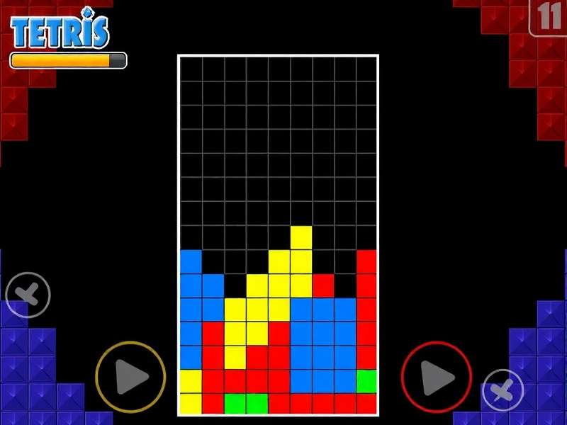 A classic GameBoy running Tetris on a wooden table